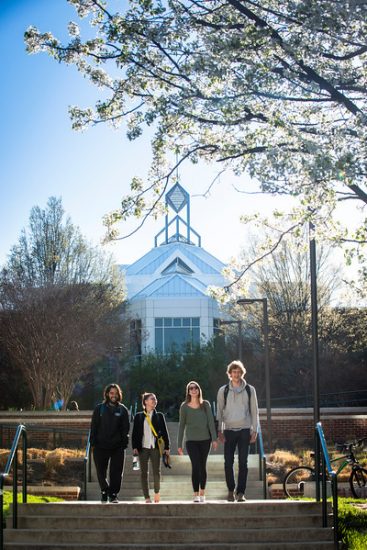 Students walking on the Fairfax Campus in Spring. Photo by Evan Cantwell/Creative Services/George Mason University