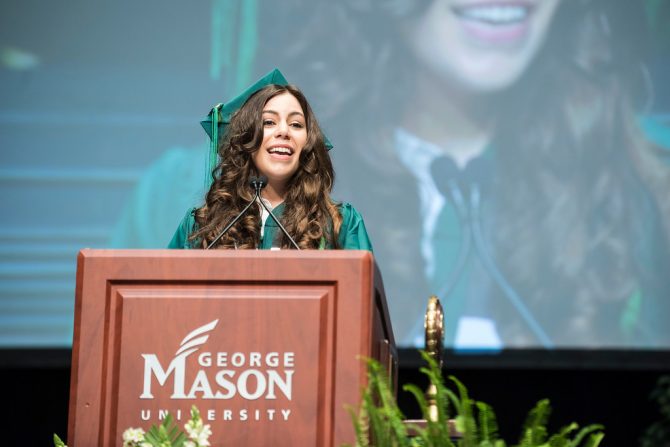 Tamara Abdelsamad, Bachelor of Science in Global and Community Health, gives the student address during 2017 commencement ceremony in Eagle Bank Arena, Fairfax, Virginia. Photo by: Ron Aira/Creative Services/George Mason University